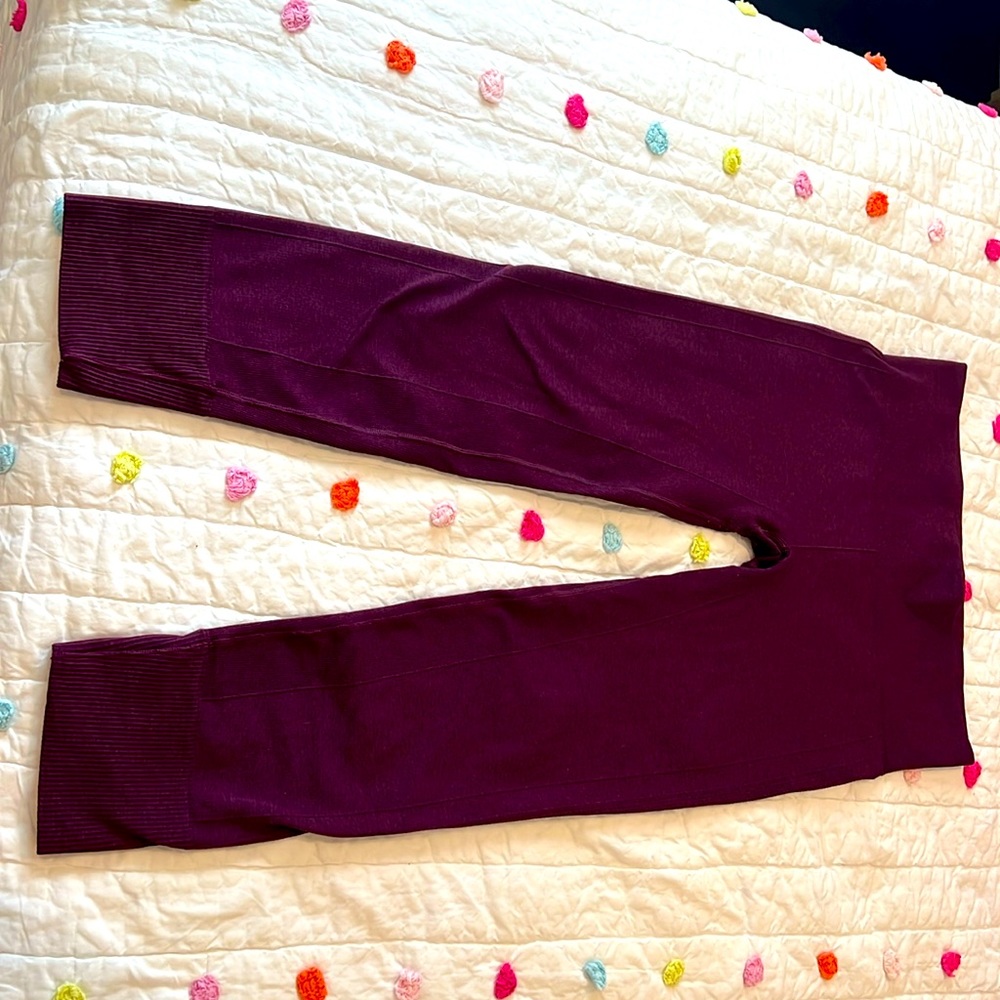 Size 12, purple Lululemon leggings with ribbed detail at waist, and at hem.